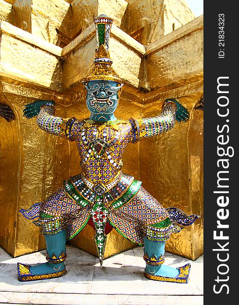 Thai demon on golden pagoda at the Grand Palace. Bangkok, Thailand. Thai demon on golden pagoda at the Grand Palace. Bangkok, Thailand