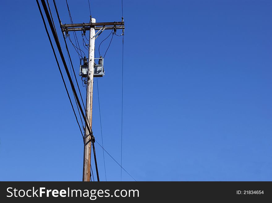 Power pole holding,electric and telepphone lines.