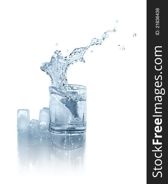 Few ice cubes near glass of splashing water on white background. Isolated with clipping path. Few ice cubes near glass of splashing water on white background. Isolated with clipping path