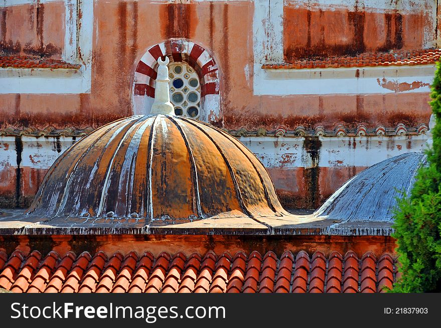 A close up of terracotta tiles on a byzantine mosque roof in greece