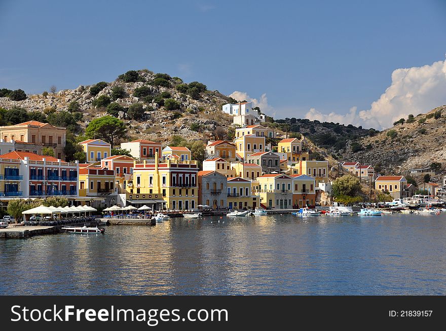 The town of symi on the greek island of the same name viewed from a boat in the harbour. The town of symi on the greek island of the same name viewed from a boat in the harbour