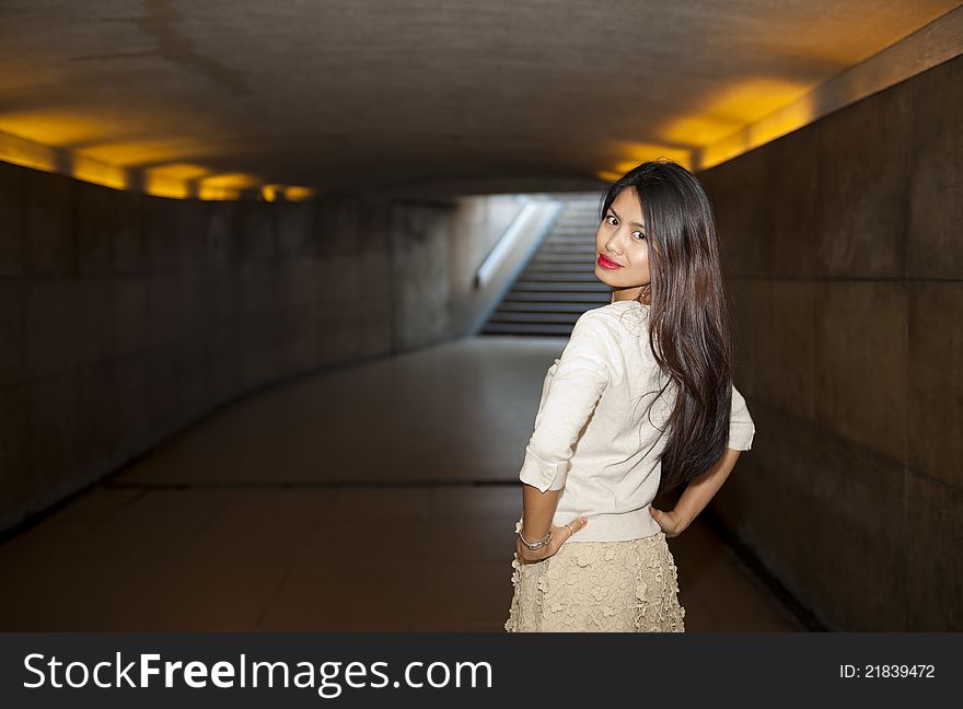 Beautiful woman posing in underpass