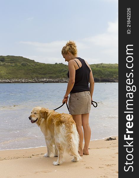 Girl on the beach with his dog Cantabria. Girl on the beach with his dog Cantabria