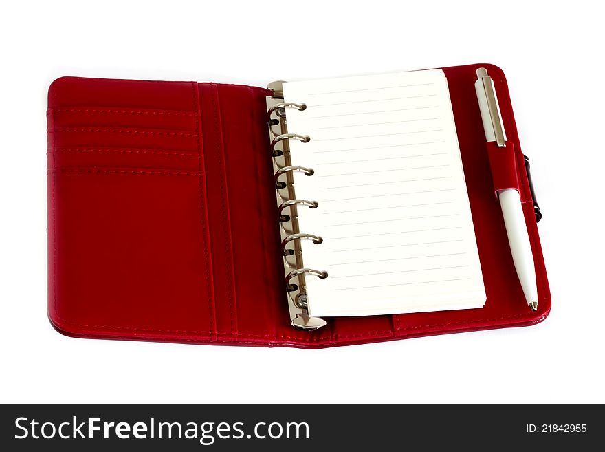 Red Notebook And A Pen With White Paper.