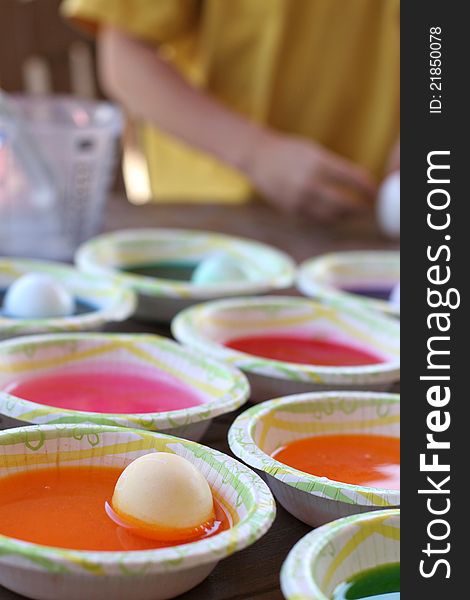 Bowls of colorful dye and eggs. Bowls of colorful dye and eggs