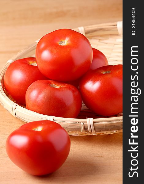 Fresh tomato on wooden table top