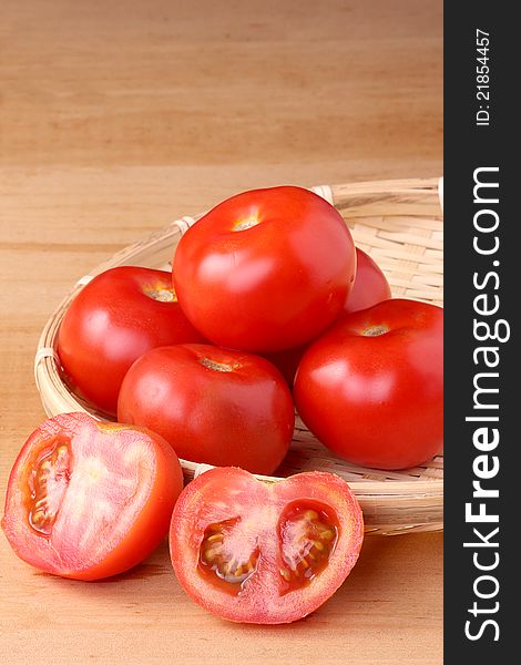 Fresh tomato on wooden table top