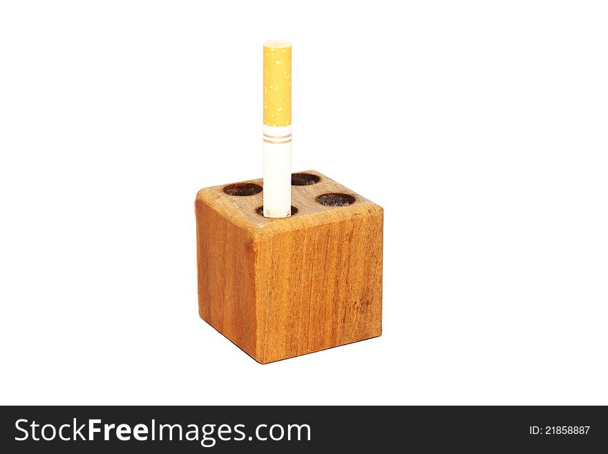 Partially smoked cigarette in a snuff block to symbolize quit smoking. Partially smoked cigarette in a snuff block to symbolize quit smoking.