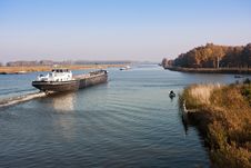 Big Dutch Canal And A Cargo Vessel Royalty Free Stock Photography