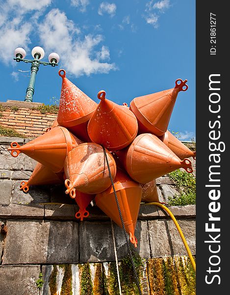 A group of mooring buoy next to the harbour in Napoli, Italy