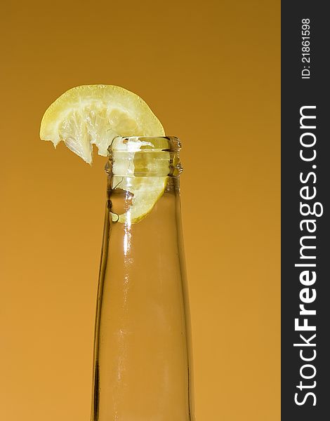 Bottle With Chunk Of Lemon
