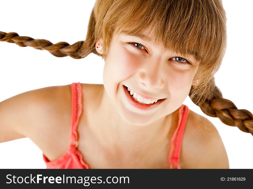 Portrait of sweet little redhead girl with braids, looking at camera and smiling. Portrait of sweet little redhead girl with braids, looking at camera and smiling