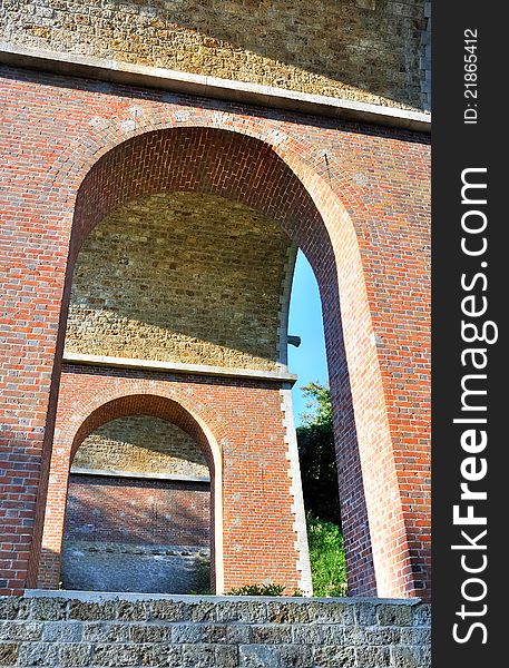 Row of arches of a bridge red brick. Row of arches of a bridge red brick