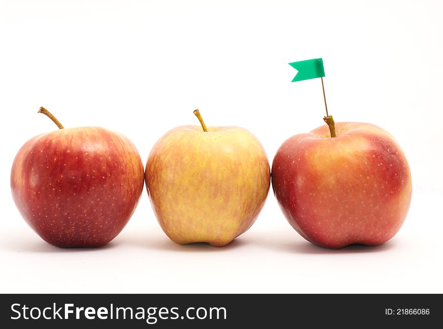 Three apples with button flag on white background