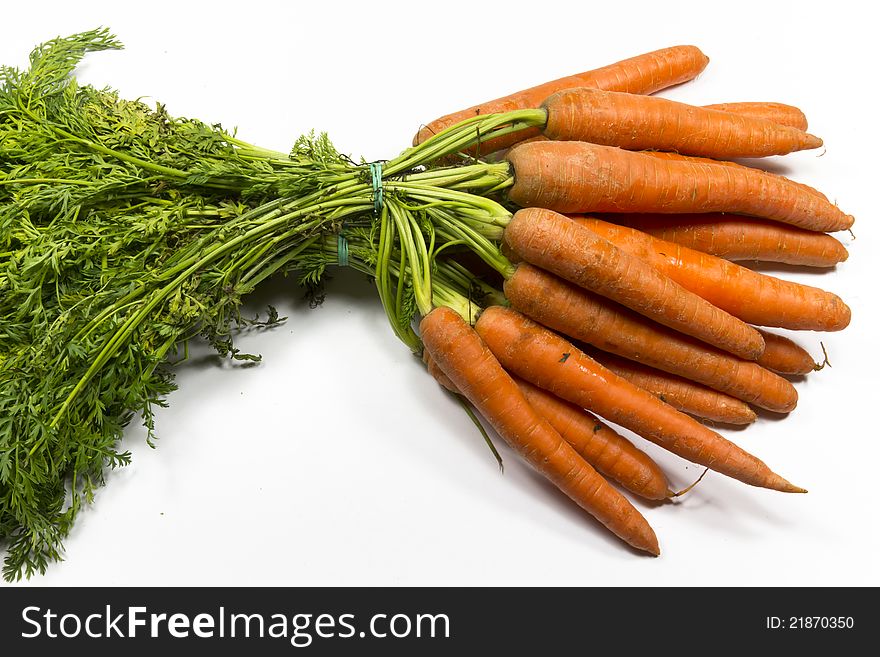 Bunch of fresh carrots with flowers