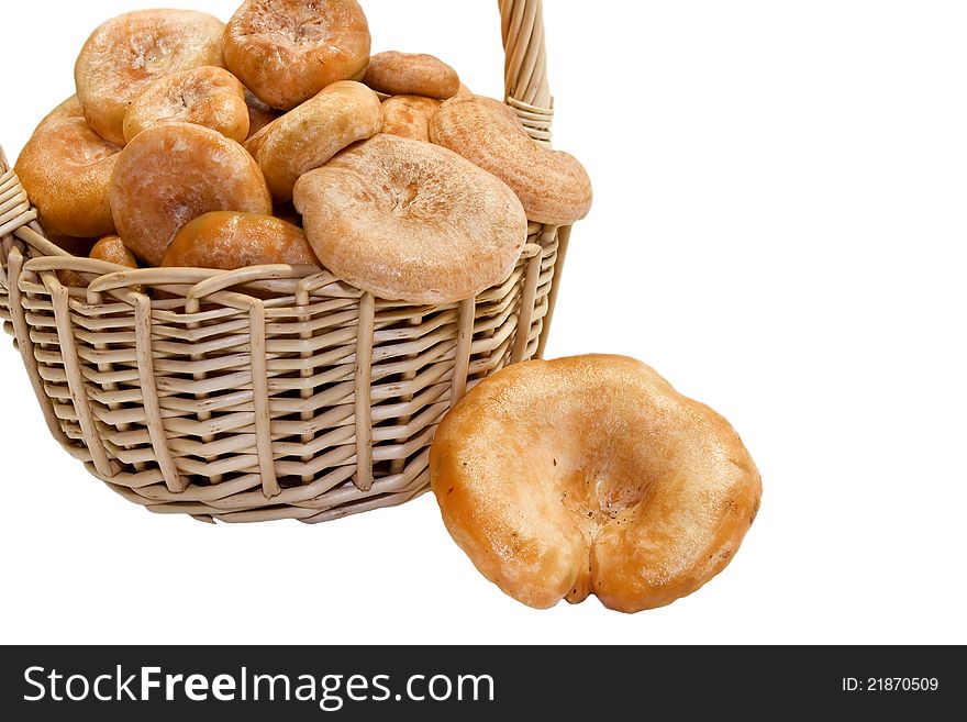 The full basket of forest mushrooms on a white background. The full basket of forest mushrooms on a white background.