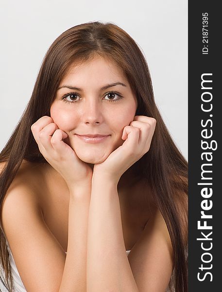 Close-up portrait of beautiful smiling woman with brown eyes