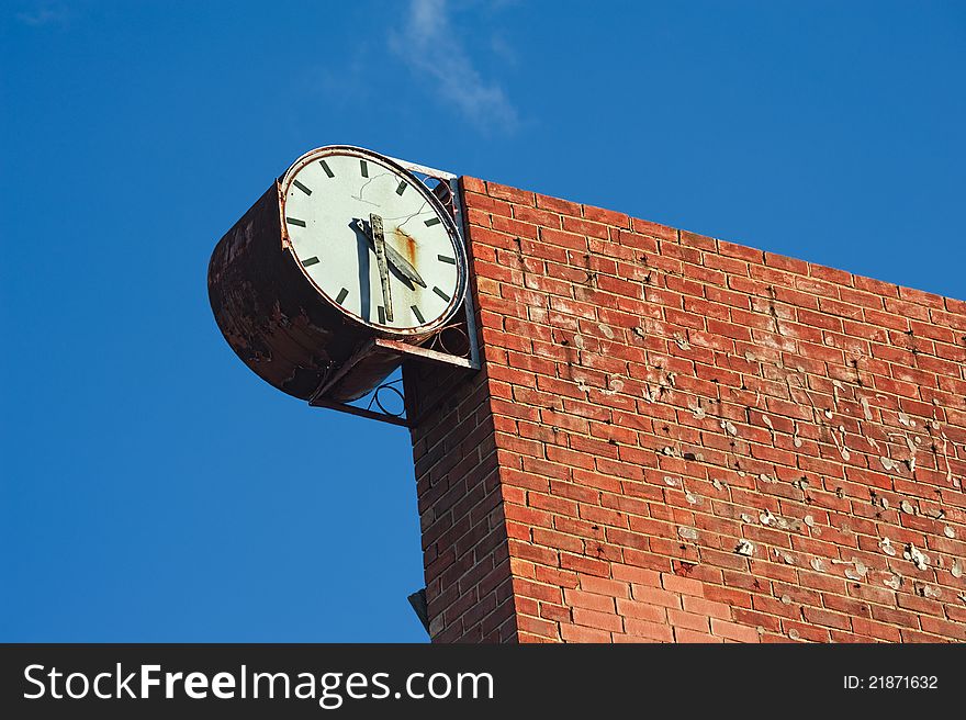 Old and broken town clock and brick wall. Old and broken town clock and brick wall