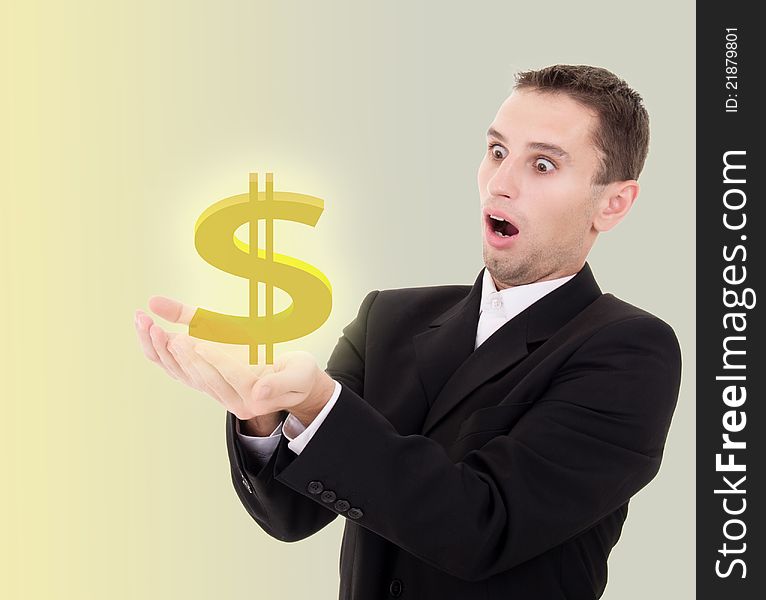 Young businessman chooses golden US dollar sign