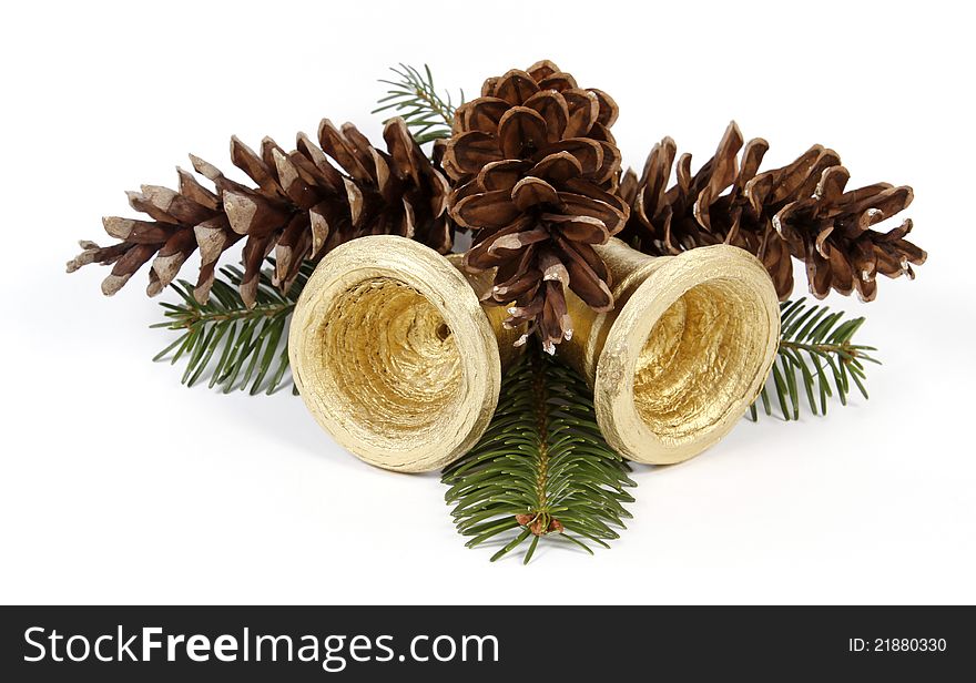 Pine cones and golden bells on the white background. Pine cones and golden bells on the white background