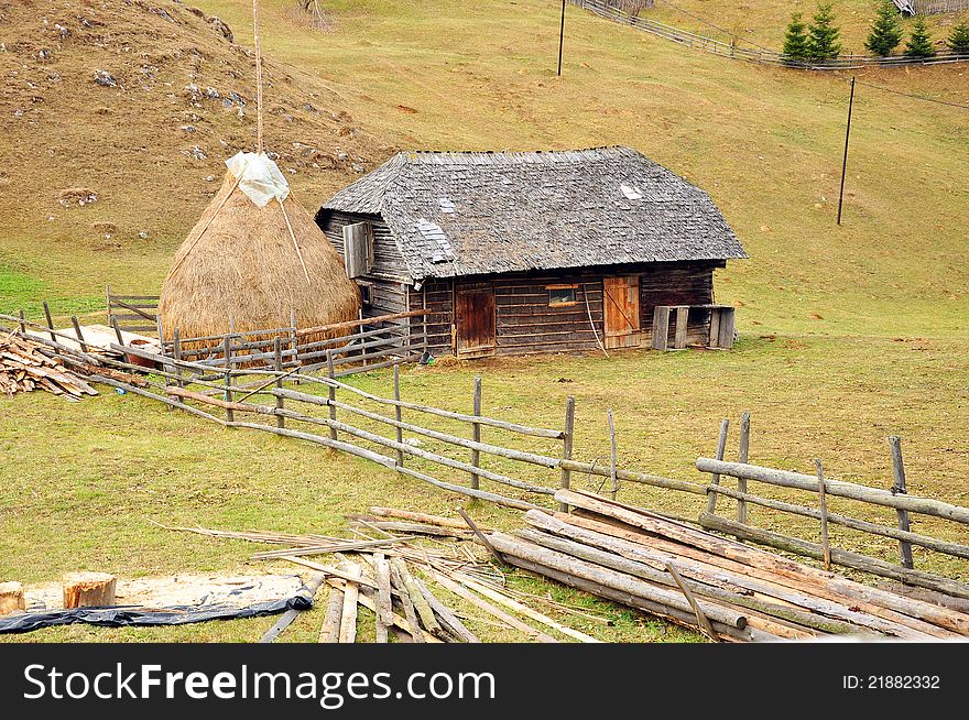 Generic transylvania rural household with old house and haycock. Generic transylvania rural household with old house and haycock