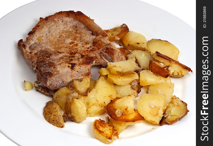 Plate with pork chop and potato on white background. Plate with pork chop and potato on white background