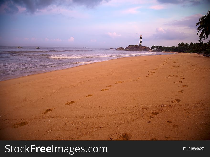 Beautiful view of beach and light house  very near udupi Karnataka India. Image is taken very early in the morning