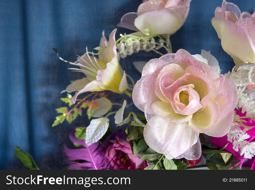 Fake flowers and pink roses made of fabric for decoration. Fake flowers and pink roses made of fabric for decoration