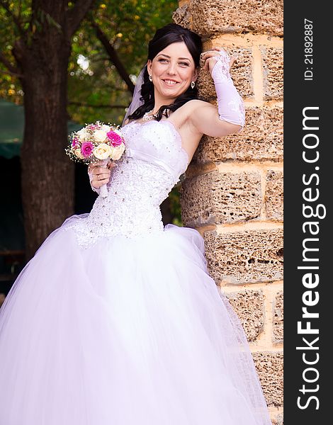 Portrait of a beautiful happy bride outdoor