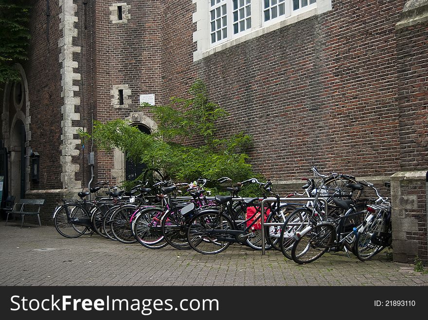 Amsterdam bicycles near an old building. Amsterdam bicycles near an old building