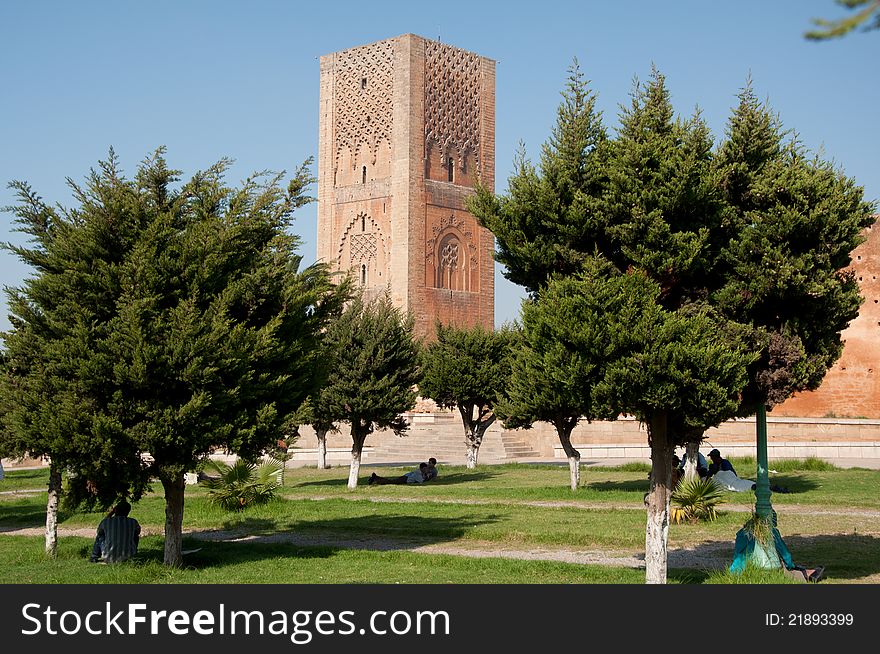 Park in front of Le Tour Hassan in Rabat. Minaret of an incomplete mosque in the background.