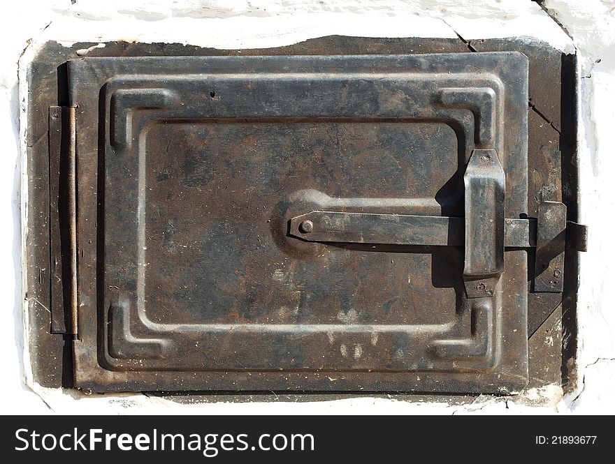 Closeup of a romanian traditional old oven door, raw