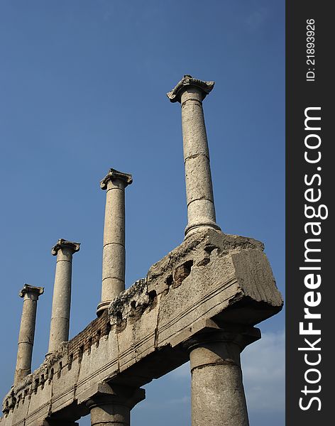 An image of a group of columns in the ruins of Pompei, Italy. An image of a group of columns in the ruins of Pompei, Italy