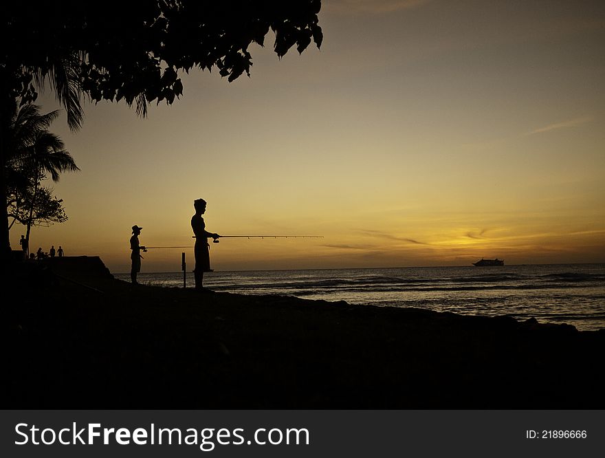 Sunset fishing at Ala Moana Beach Park