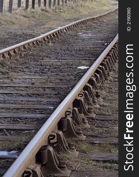 Rusting railway tracks looming into the distance. Rusting railway tracks looming into the distance