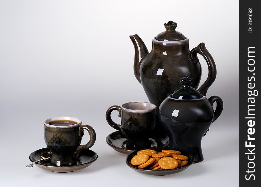 Teapot, cup of tea, sugar-basin. Teapot, cup of tea, sugar-basin
