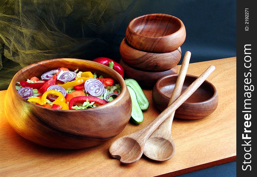 Salad from vegetables in wooden utensils