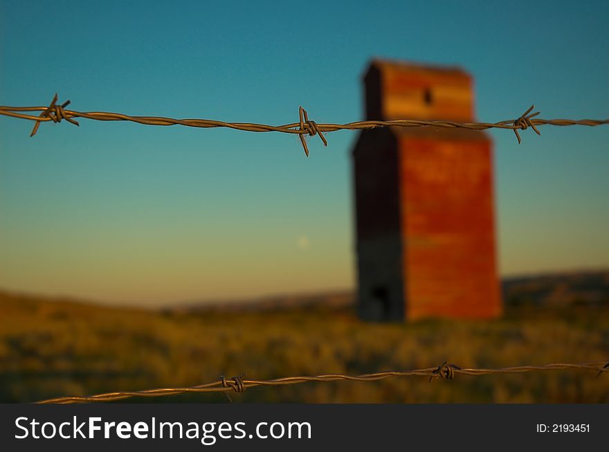 Long abandoned grain elevator in the badlands of the great plains.