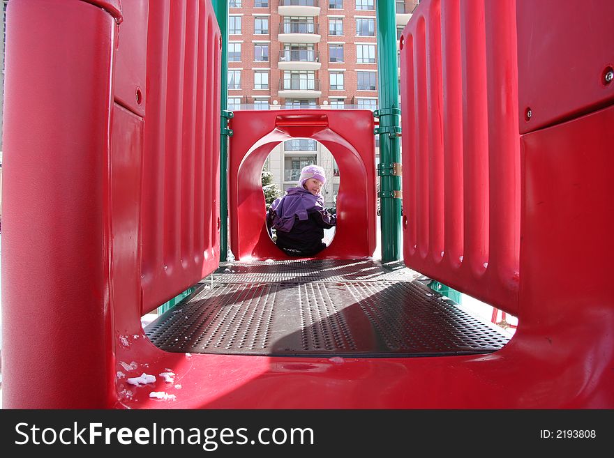 Little girl playing on the playground