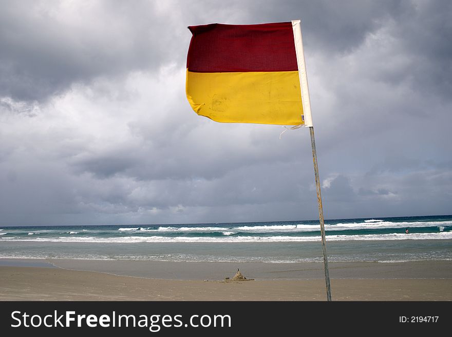 A lifesaver flag warns of dangerous surfing conditions