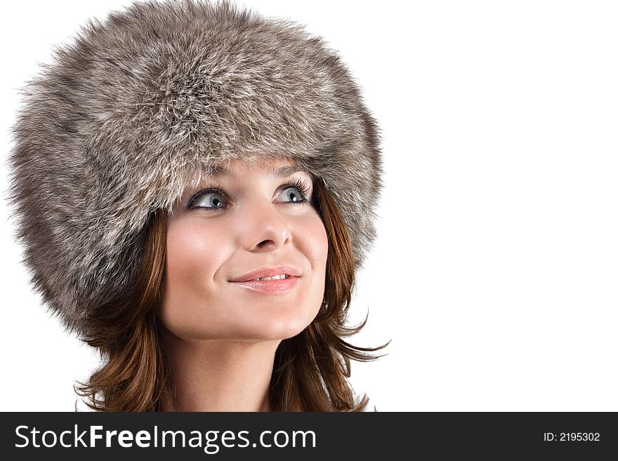 Portrait of a white beautiful woman in a fur hat. Portrait of a white beautiful woman in a fur hat