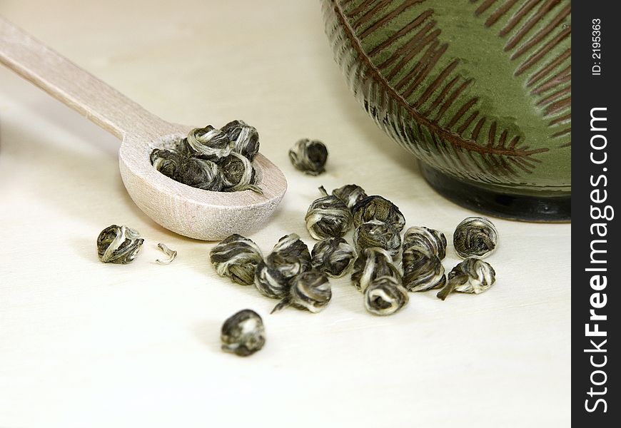 Jasmine green tea called Dragon Tears. With bamboo tea strainer.