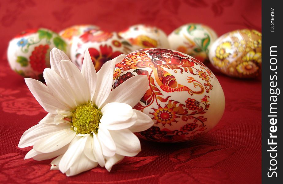 Beautiful red easter eggs and flower