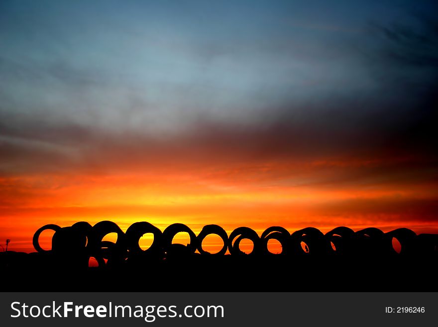Sun set landscape with big concrete rings