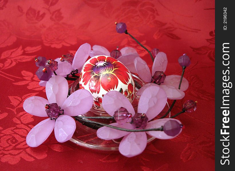 Easter egg with flowers on red background