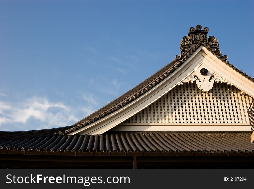 Detailed shot of a temple rooftop in Kyoto, Japan.