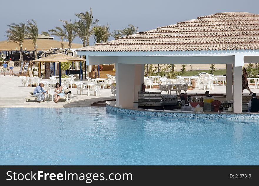 Pool bar at the tropical resort in a bright sun. Pool bar at the tropical resort in a bright sun