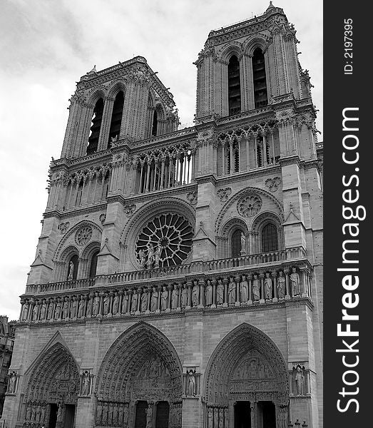 Black and white photograph of the facade of the famous cathedral of Notre Dame in Paris, France. Black and white photograph of the facade of the famous cathedral of Notre Dame in Paris, France.