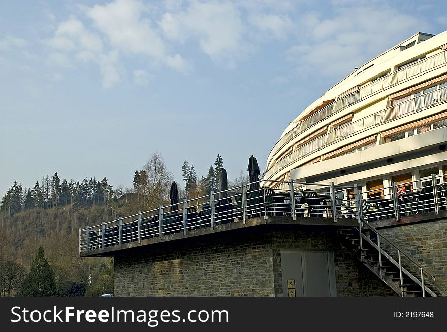 Hotel view in mountains with blue sky and clouds. Hotel view in mountains with blue sky and clouds