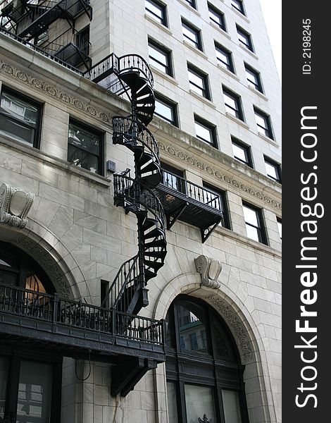 A spirla staircase fire escape on the exterior of a building, Boston.